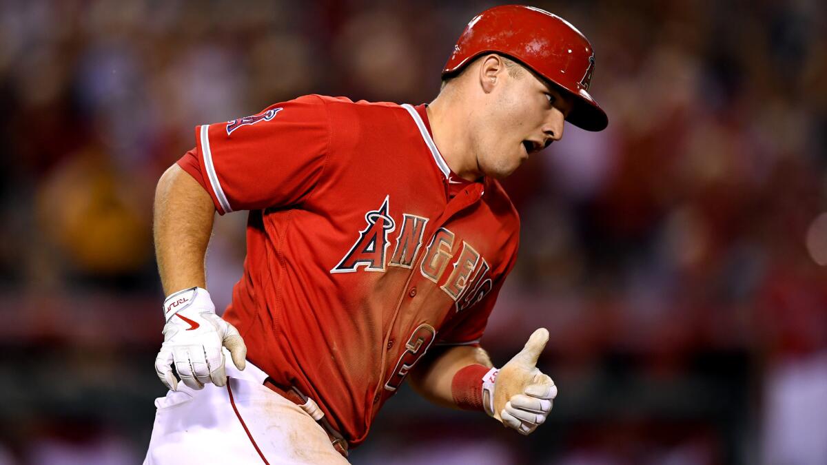 Angels center fielder Mike Trout rounds first base after hitting a home run off Mariners ace Felix hernandez on Monday night.