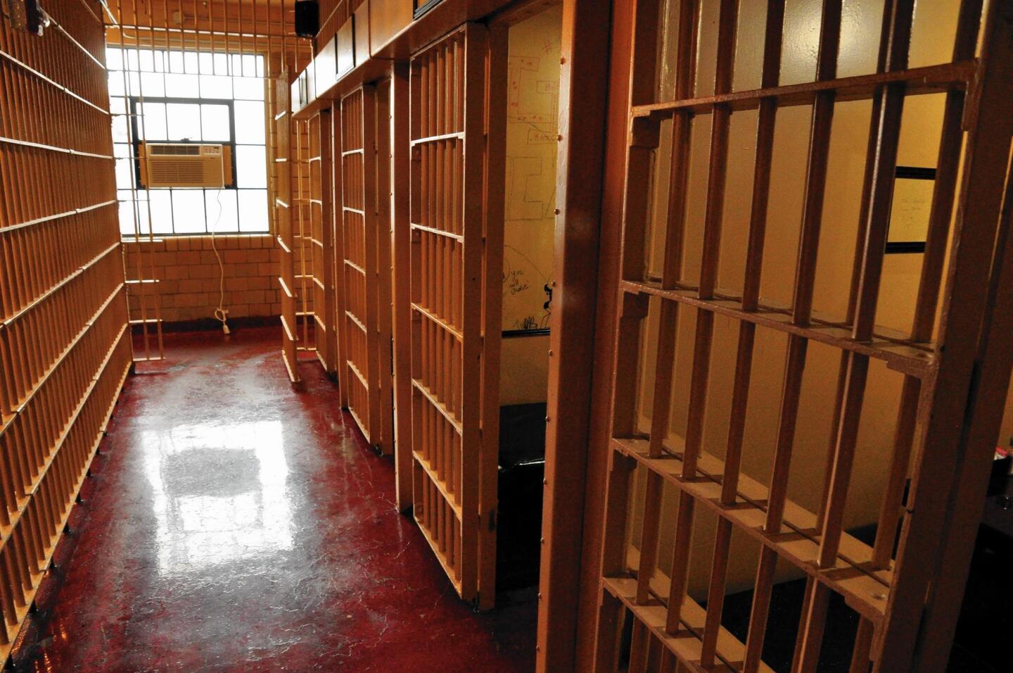 A corridor in the old Boone County Jail in Lebanon, Ind., opens onto individual cells where diners are seated.