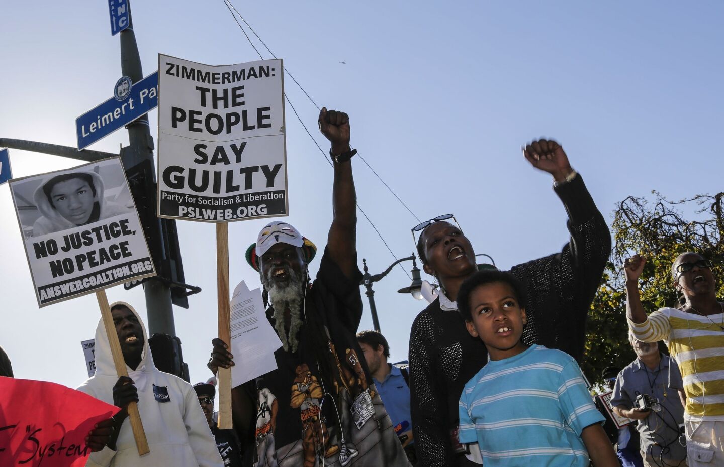 Participants chanting slogans during rally protesting the acquittal of George Zimmerman in the shooting death of Trayvon Martin, at Leimert Plaza Park on Monday.