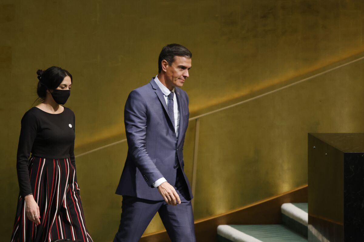 President of Spain Pedro Sanchez, right, arrives to address the 77th session of the United Nations General Assembly at U.N. headquarters, Thursday, Sept. 22, 2022. (AP Photo/Jason DeCrow)