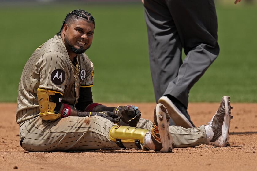San Diego Padres' Luis Arraez sits at second after being tagged out trying to advance on his RBI single during the fifth inning of a baseball game against the Kansas City Royals Sunday, June 2, 2024, in Kansas City, Mo. (AP Photo/Charlie Riedel)