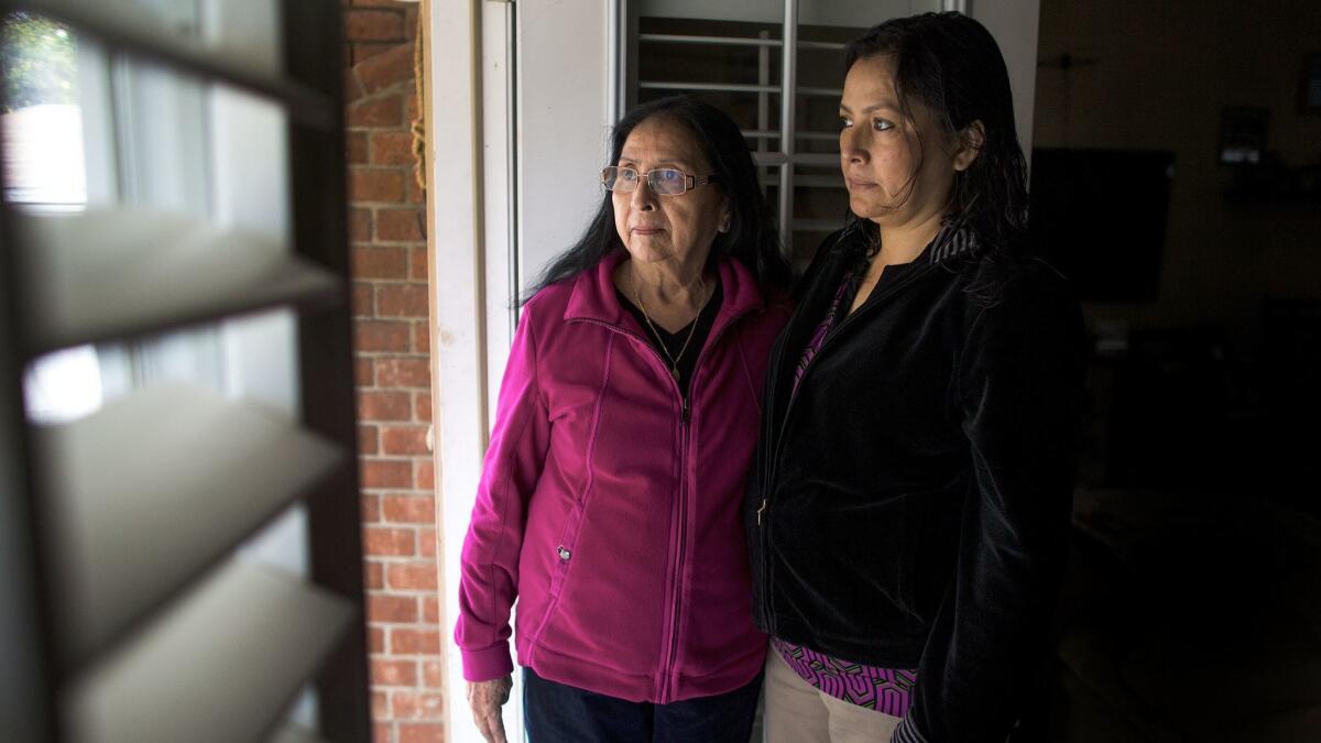 Bianca Salgado,left, and Leticia Zelaya are holding out hope that their granddaughter and niece Mayra Machado,31, will get released from an immigration detention in Louisiana where she's been held for about a year.