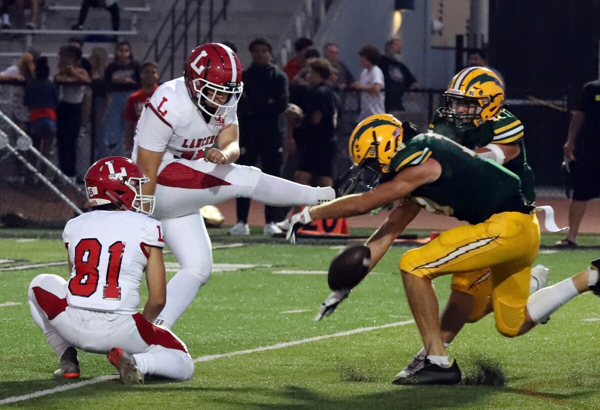 Edison's Jackson Irwin (18) blocks a field-goal attempt against Orange Lutheran in a nonleague game on Sept. 2.
