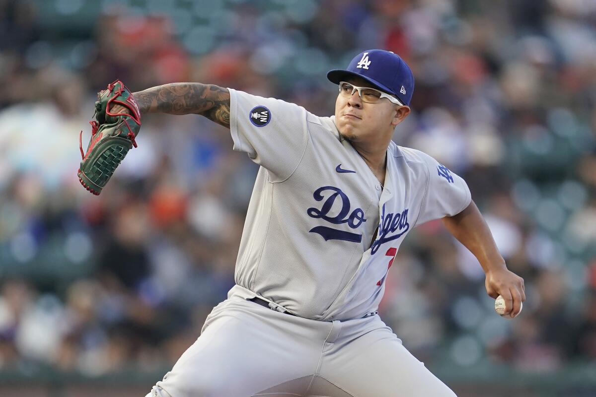 Dodgers pitcher Julio Urías delivers in the first inning of a 3-0 win over the Giants on Wednesday.