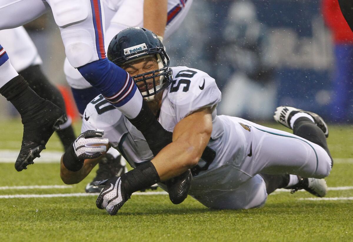 Russell Allen tries to make a tackle as the Jacksonville Jaguars play against the Buffalo Bills.