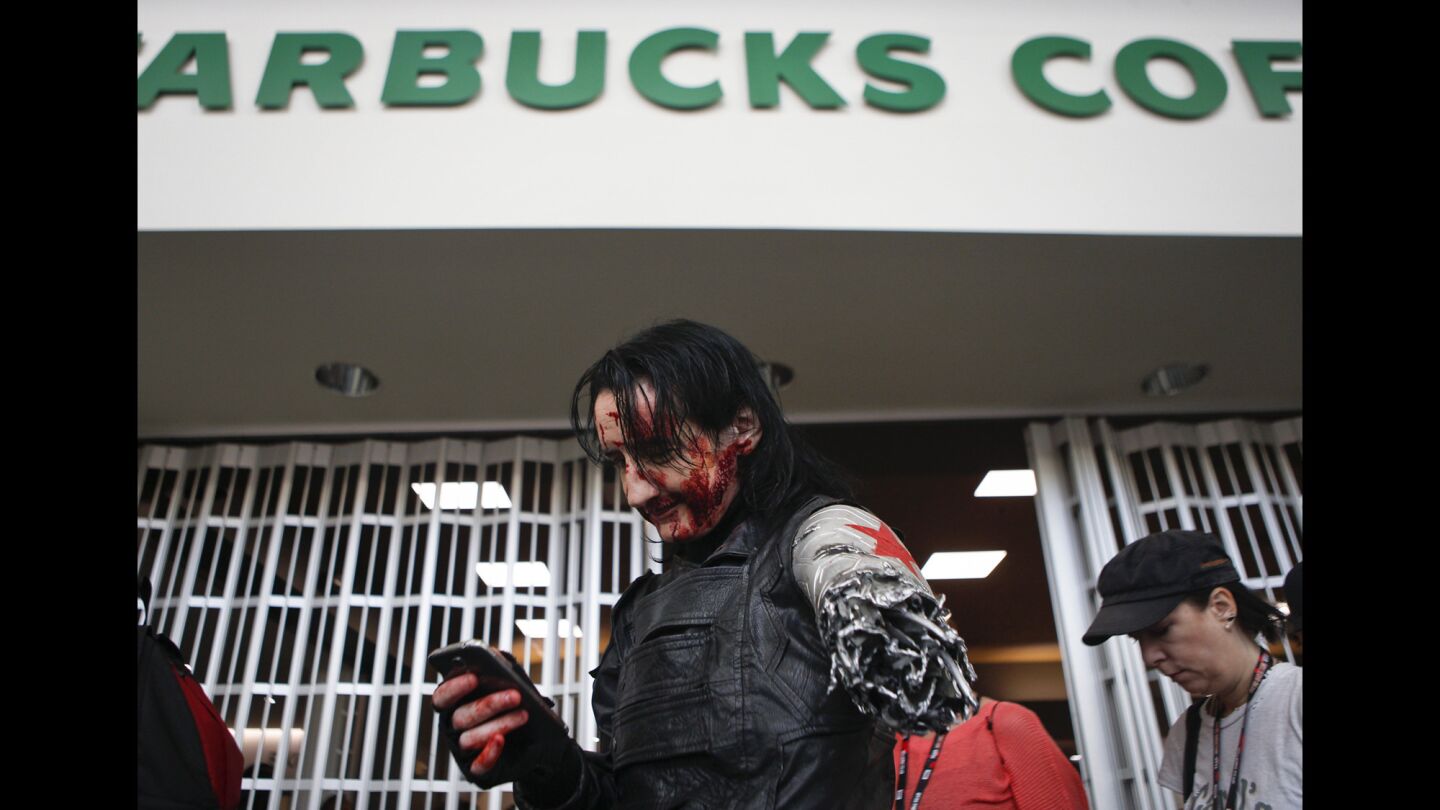 Dawn Richardson, 40, of Vancouver, Canada, waits in line at Starbucks during the second day of Comic-Con. Richardson was dressed as Bucky Barnes from "Captain America: Civil War."