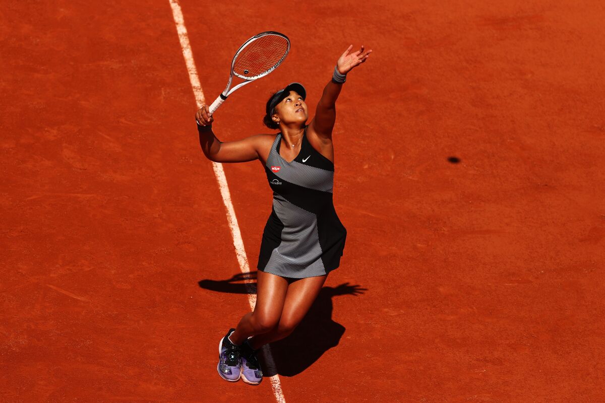 Naomi Osaka serves during her first-round win over Patricia Maria Tig at the French Open on Sunday.