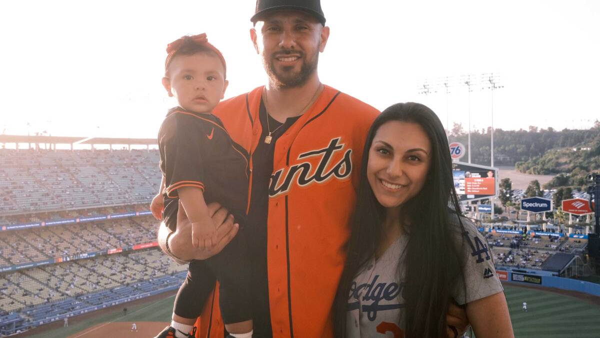 She's a Dodgers fan. He's a Giants fan. Can they survive the NLDS