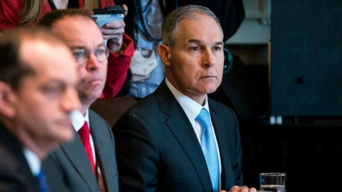 Environmental Protection Agency chief Scott Pruitt listens to President Trump speak to the media before a Cabinet meeting at the White House on April 9.