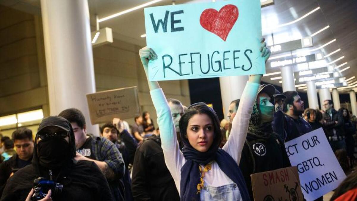 Protesters gather in front of the Tom Bradley International Terminal at Los Angeles International Airport after President Trump halted travel from seven majority-Muslim countries.
