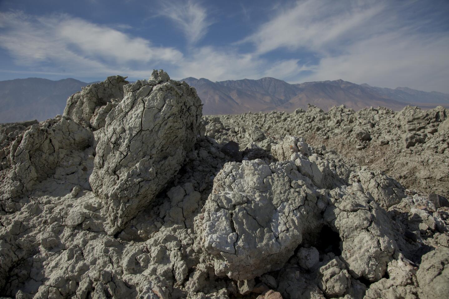 Under a new approach, dirt clods the size of basketballs and larger will be used to control dust on the dry Owens Lake bed. The clods will bottle up the dust for years before breaking down, at which point the process will be repeated.
