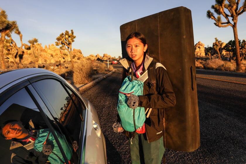 JOSHUA TREE, CA JANUARY 24, 2019 --- Jacelyn Kong, 21, from San Gabriel Valley, arrives early morning for bouldering at Joshua Tree National Park. Joshua Tree National Park fully reopened on Saturday, Jan. 26, with the return of its rangers and long lines of nature lovers at its main visitor center following word from President Trump that the partial federal government shutdown has ended, at least temporarily. (Irfan Khan / Los Angeles Times)