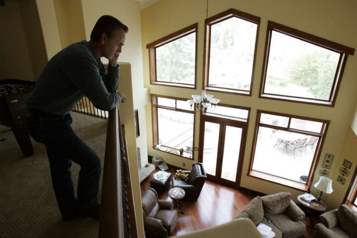 David Kassel talks on his cellphone at his home in Lakeside. A new CDC report says 138 million Americans live in homes that rely solely on wireless phones.