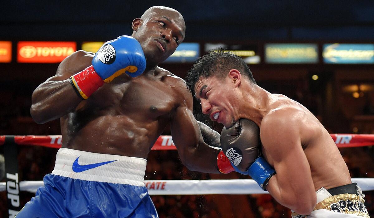 Timothy Bradley, left, connects with Jessie Vargas during a welterweight boxing match for the interim WBO title on June 27.