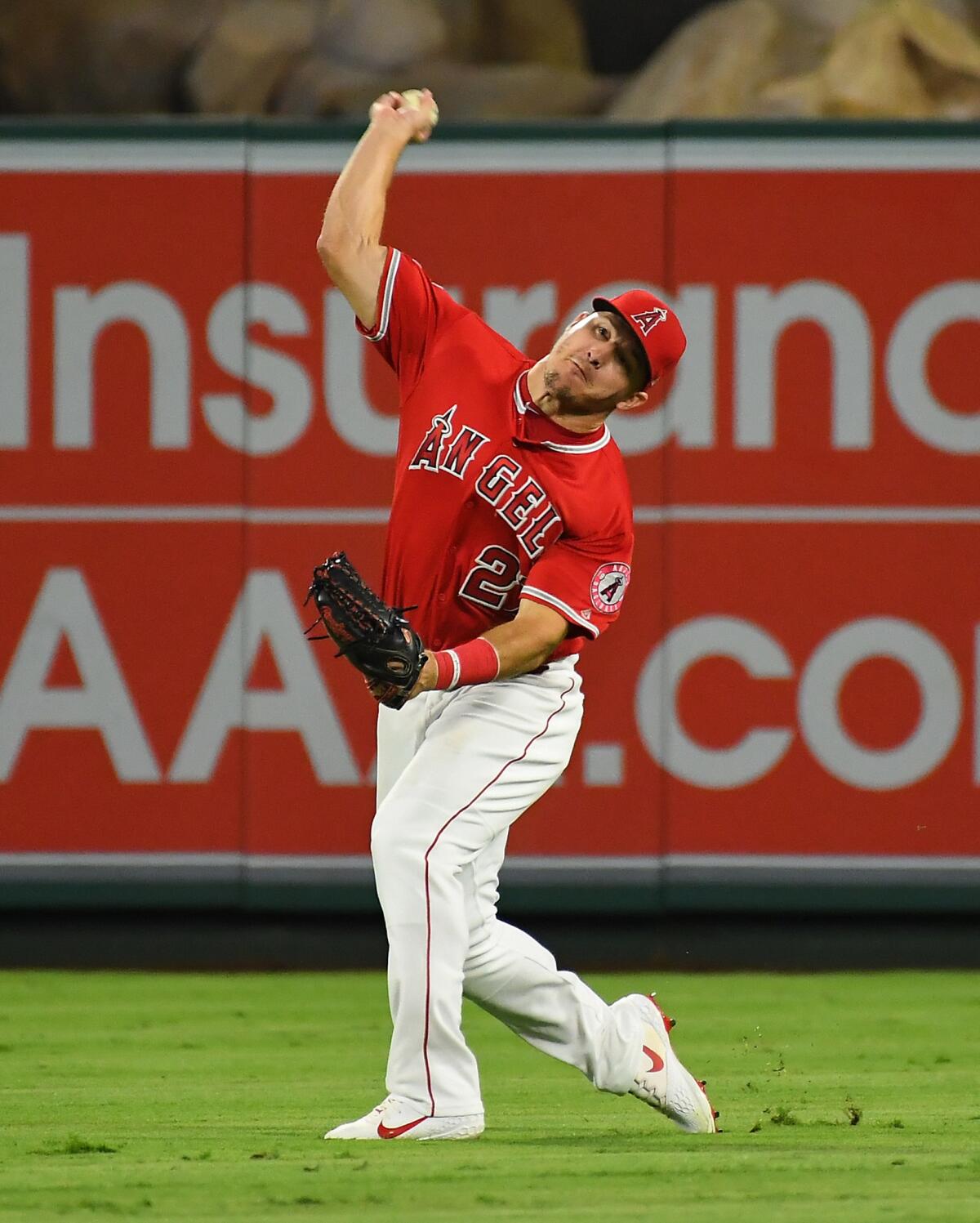 Angels outfielder Mike Trout throws out Texas' Robinson Chirinos, who was trying to score from second base on a single Wednesday night.