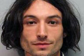 This photo provided by the Hawai'i Police Department shows actor Ezra Miller who was arrested and charged for disorderly conduct and harassment after an incident at a bar in Hilo. Miller known for playing "The Flash" in "Justice League" films was arrested Sunday after an incident at a Hawaii karaoke bar, where police say he yelled obscenities, grabbed a mic from a singing woman and lunged at a man playing darts. (Hawai'i Police Department via AP)