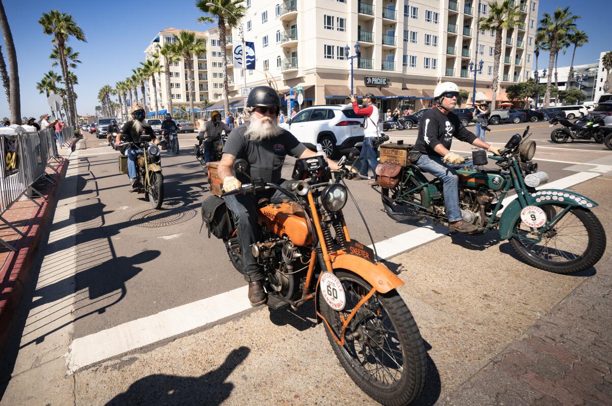 Riders competing in the Motorcycle Cannonball 2023 finish at the Oceanside Pier on Sunday.
