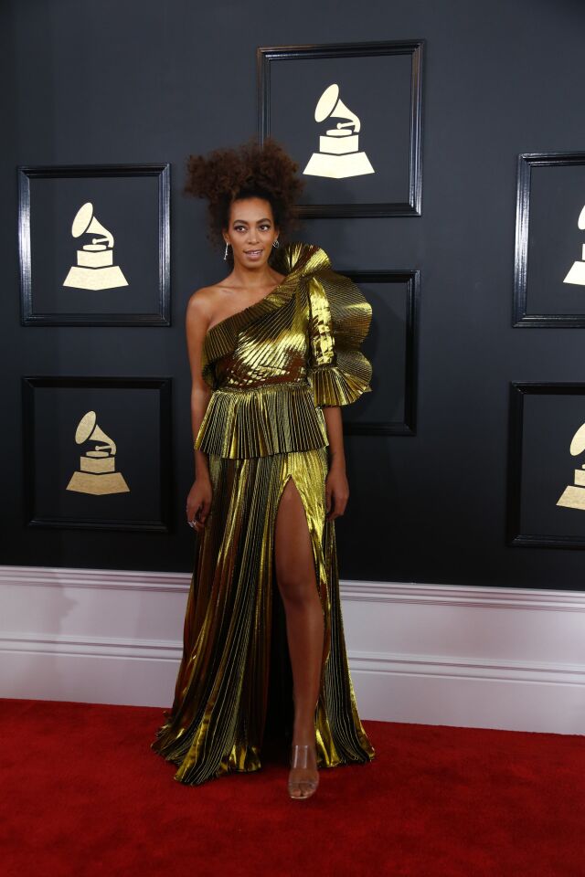 Solange Knowles arrives at the 59th Grammy Awards.