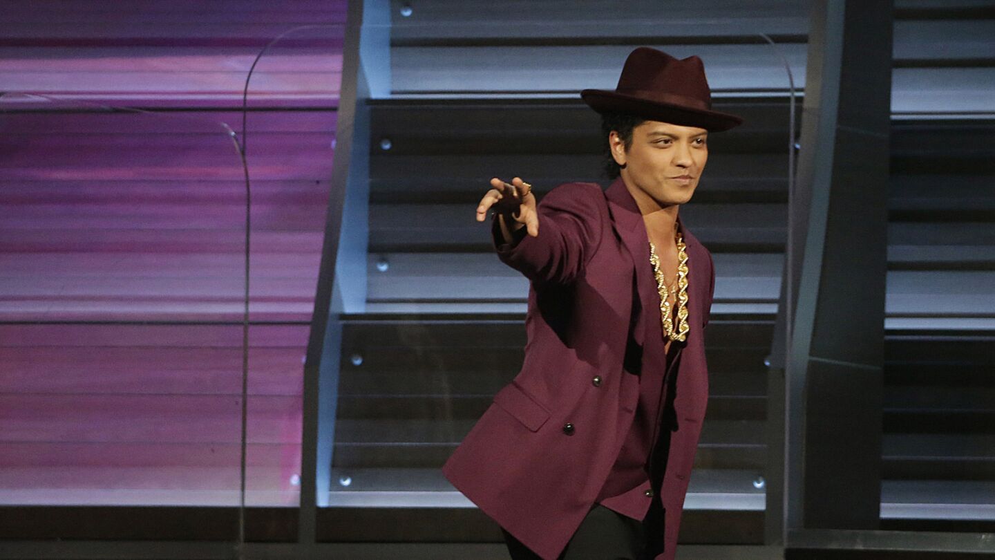 Bruno Mars hits the stage.