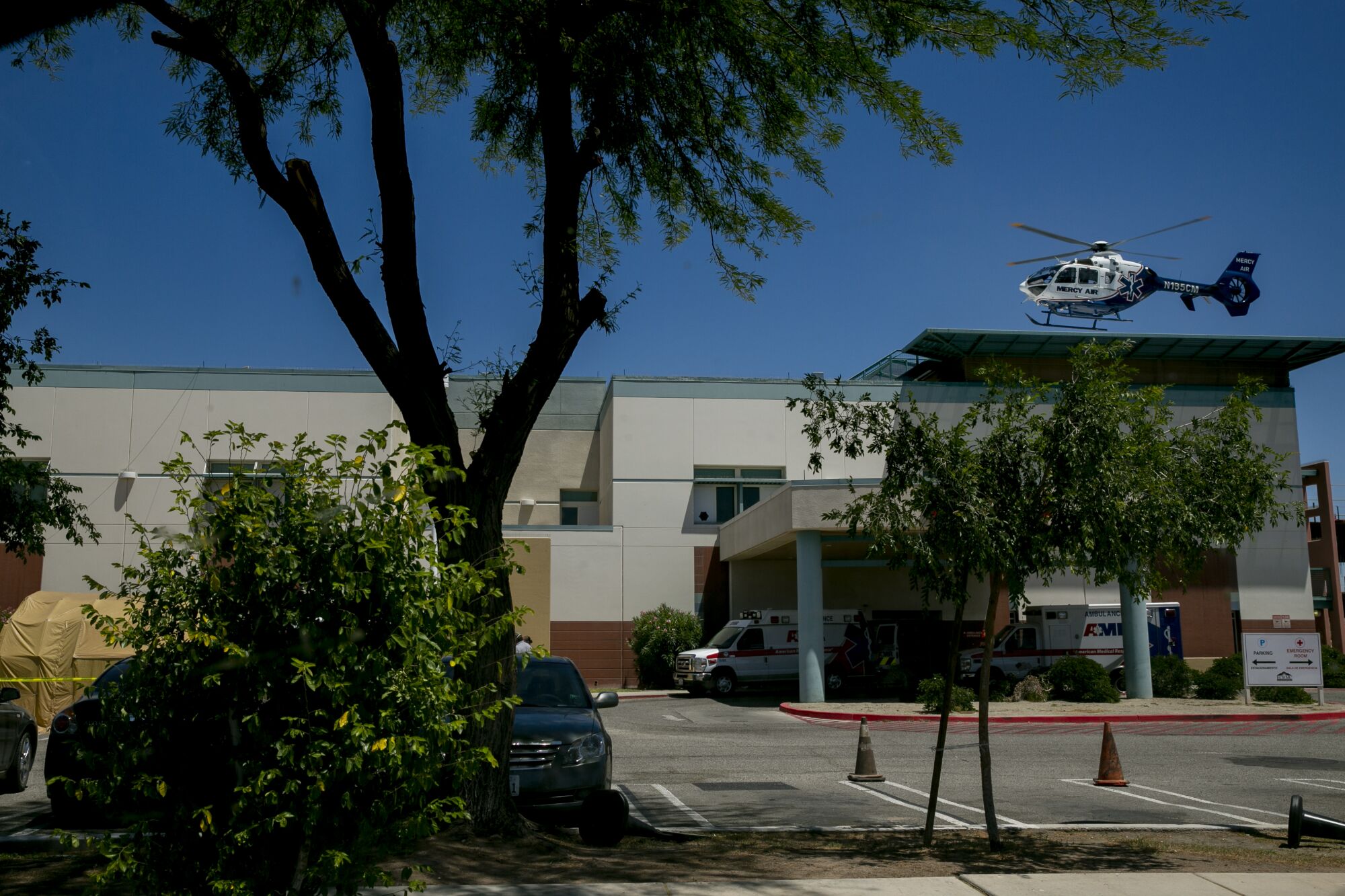 A medical helicopter lands on the roof of the El Centro Regional Medical Center.