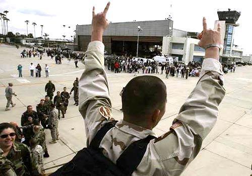 Army Reserve soldiers from the 950th Maintenance Company say their goodbyes Wednesday as they deploy en route to Iraq from the Joint Forces Training Base on the Los Alamitos Army Airfield. Two chartered planes carried the 250 soldiers to Ft. Bliss, Texas, where they will train before being shipped overseas.