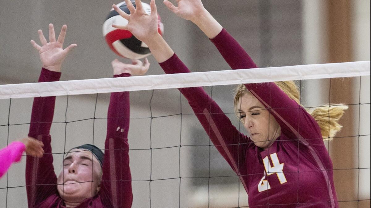 Ocean View High's Cambria Adams, left, and Helen Reynolds, pictured trying to block a shot against Garden Grove on Oct. 2, helped the Seahawks qualify for the semifinals of the CIF Southern Section Division 7 playoffs on Wednesday.