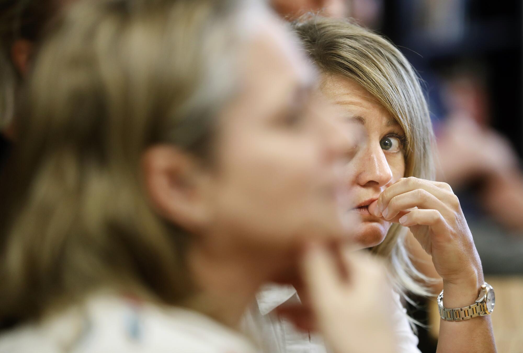 Miranda Domenico, right, listens closely during an active shooter training session held at Golden View Classical Academy, a charter school in Golden, Colo.