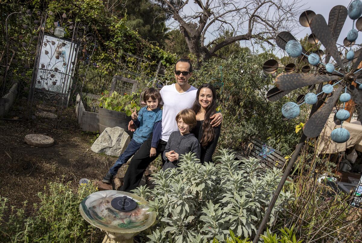The Terry family in the Arts and Roots garden, which is available for rent.