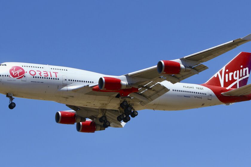 A Virgin Orbit Boeing 747-400 aircraft named Cosmic Girl prepares to land back at Mojave Air and Space Port