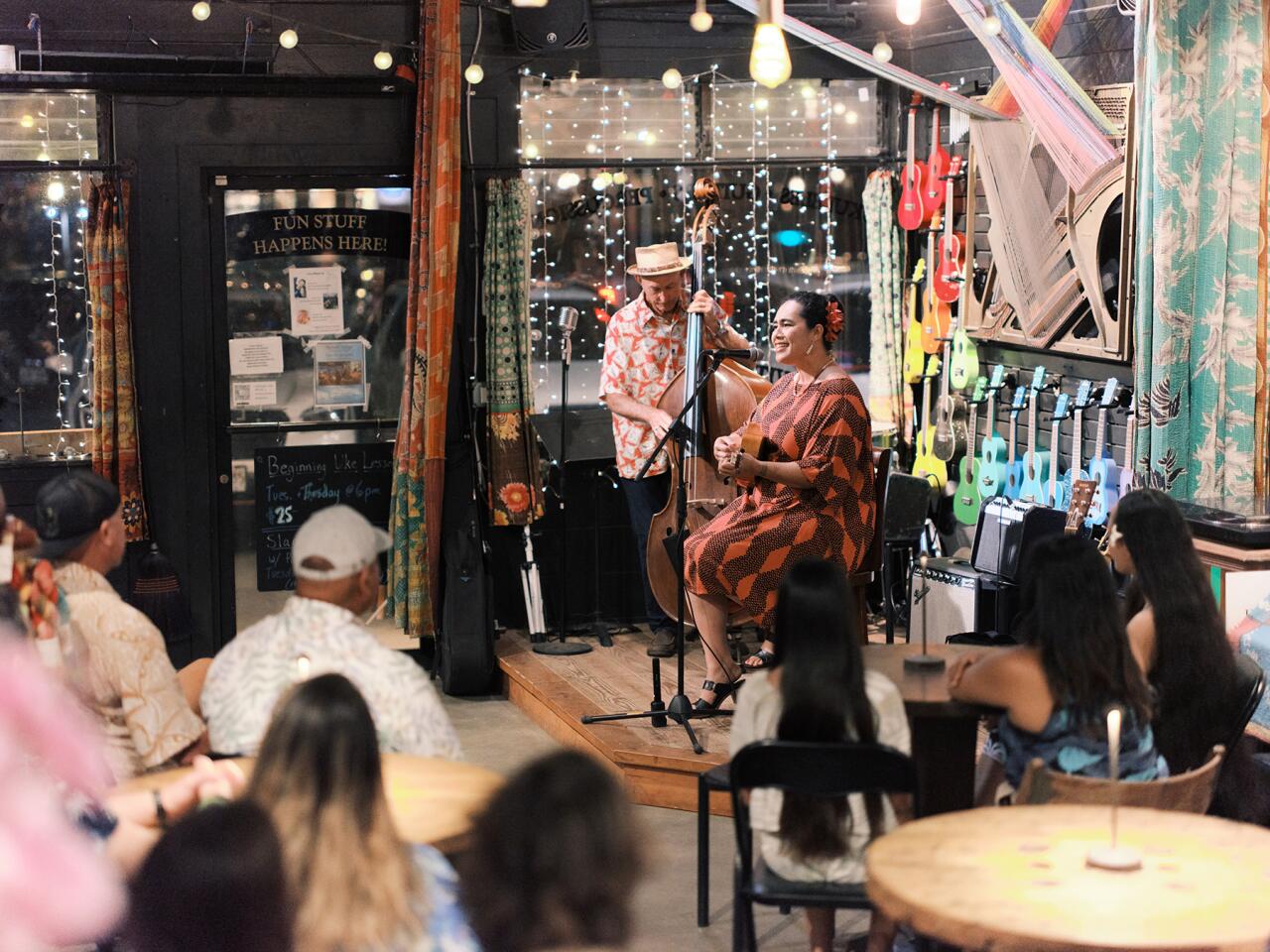 Kainani Kahaunaele performing at a local music shop.