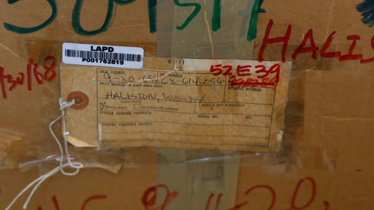 For decades, Wendy Jo Halison's belongings sat in two cardboard boxes at the LAPD, the original evidence tag from 1968 still taped to one of the boxes. (Glenn Koenig / Los Angeles Times)