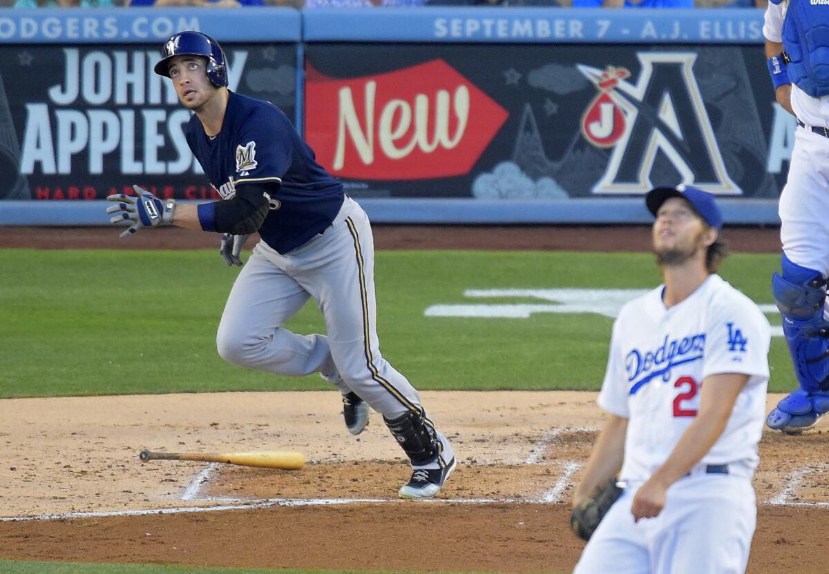 Milwaukee's Ryan Braun and Dodgers pitcher Clayton Kershaw watch Braun's two-run home run during the fourth inning of the Brewers' 3-2 victory on Saturday.