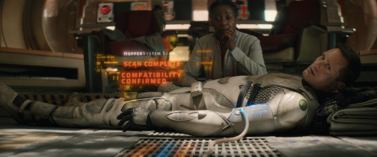 Noma Dumezweni and Alexander Skarsgård in "Murderbot," now streaming on Apple TV+.