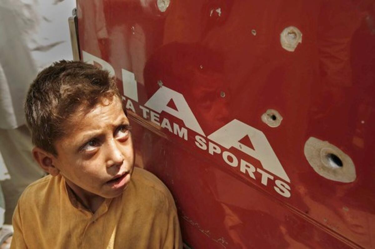 Ayaz, 5, suffered a gunshot wound to a leg. His family has taken shelter at a school.