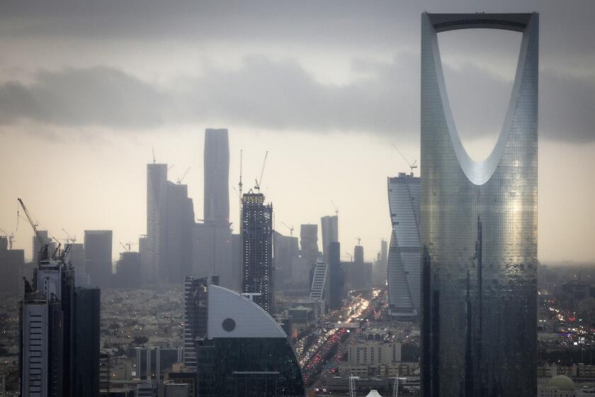 The Kingdom Tower, operated by Kingdom Holding Co., right, stands on the skyline above the King Fahd highway in Riyadh, Saudi Arabia, on Monday, Nov. 28, 2016. Saudi Arabia and the emirate of Abu Dhabi plan to more than double their production of petrochemicals to cash in on growing demand. Photographer: Simon Dawson/Bloomberg via Getty Images