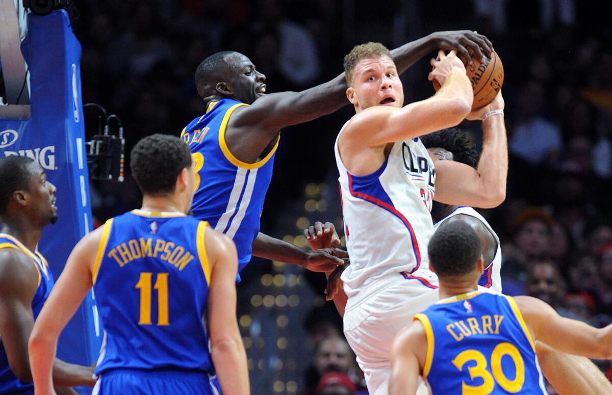 Clippers forward Blake Griffin has the ball stripped away by Warriors forward Draymond Green during a Nov. 19 game at Staples Center.