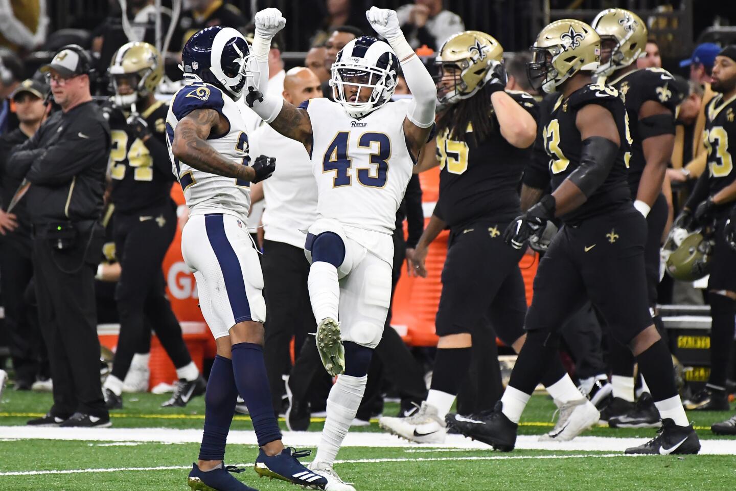 Rams safety John Johnson (43) celebrates his interception against the New Orleans Saints in overtime in the NFC Championship at the Superdome in New Orleans Sunday.