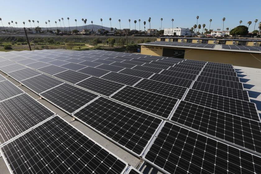 A large-scale solar panel project sits atop warehouses No. 9 and 10 at the Port of Los Angeles in San Pedro, which have been converted into retail space for shops and a microbrewery.