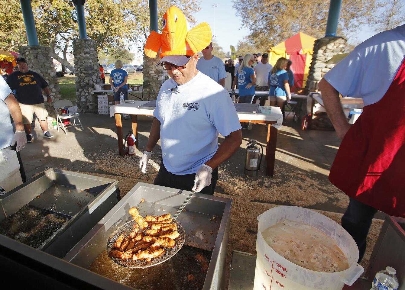 Raul Jara cooks fresh Icelandic cod for the 71st annual Costa Mesa-Newport Harbor Lions Club Fish Fry at Fairview Park in Costa Mesa on Friday, opening day of the three-day festival.