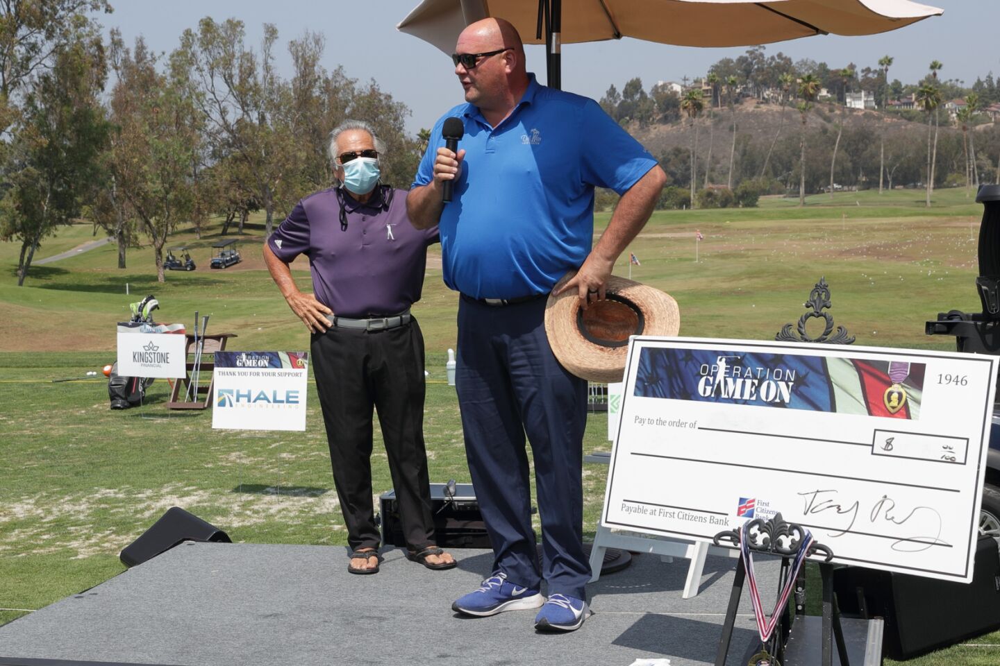 Chris Lesson of Del Mar Golf Center leads the National Anthem at the Operation Game On event