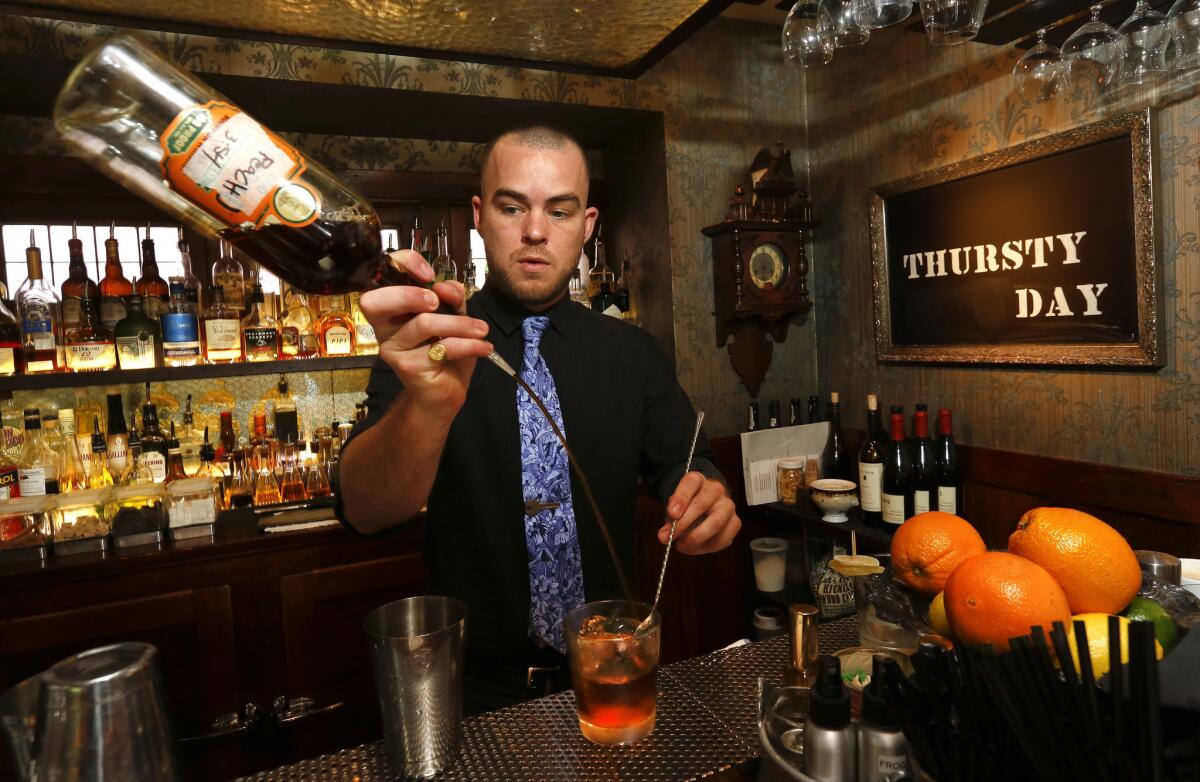 Bartender Peter Lloyd Jones makes a drink at The Raymond 1886 restaurant in Pasadena. Californians can consider themselves lucky: their state charges less in taxes than the national average for import taxes on beer, wine and liquor.