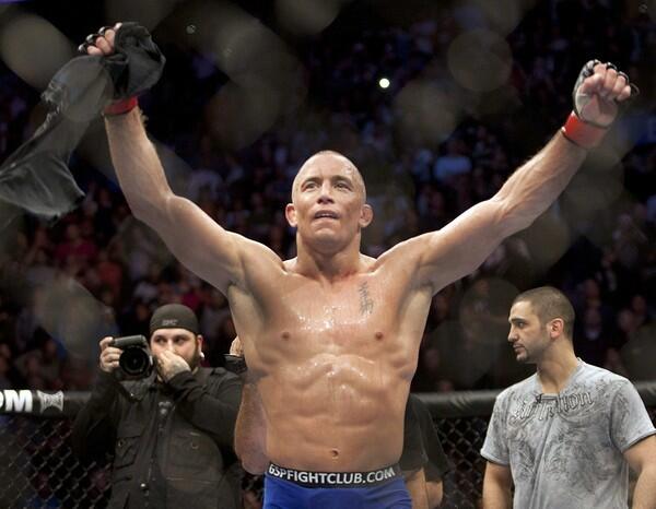Georges St-Pierre celebrates his 50-45 decision over Josh Koscheck to retain the UFC welterweight crown on Saturday night in Montreal.