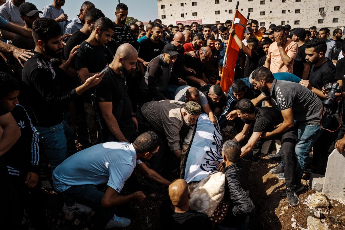 Mourners at funeral of Palestinian man killed by an Israeli airstrike
