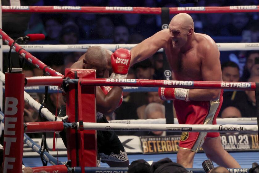 FILE - Tyson Fury, right, lands a punch during his WBC heavyweight championship boxing match against Derek Chisora at Tottenham Hotspur's White Hart Lane stadium London, on Dec. 3, 2022. Tyson Fury will face Oleksandr Usyk in Saudi Arabia in the first fight this century to unify all of the four major heavyweight boxing titles, Fury's promoter Frank Warren said Friday, Sept. 29, 2023. (AP Photo/Ian Walton, File)