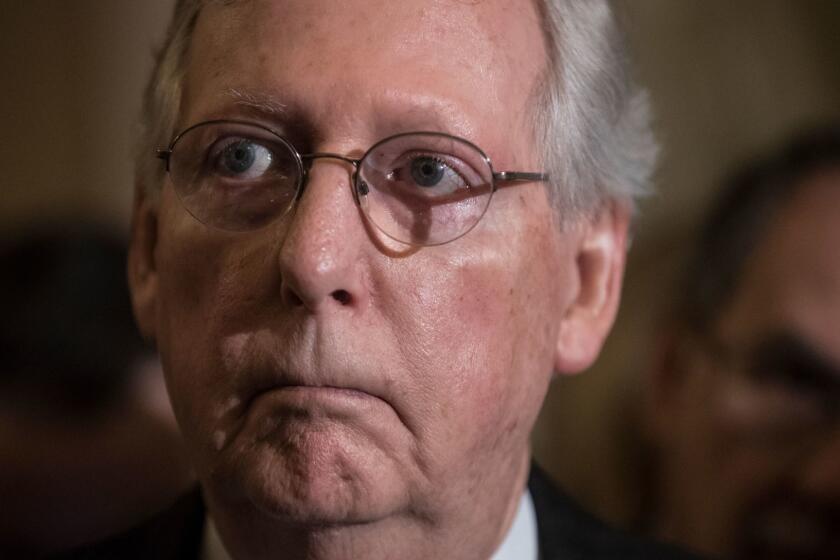 Senate Majority Leader Mitch McConnell, R-Ky., listens to remarks by Sen. Lindsey Graham, R-S.C., during a news conference as they faced assured defeat on the Graham-Cassidy bill, the GOP's latest attempt to repeal the Obama health care law, at the Capitol in Washington, Tuesday, Sept. 26, 2017. The decision marked the latest defeat on the issue for President Donald Trump and Senate Majority Leader Mitch McConnell in the Republican-controlled Congress. (AP Photo/J. Scott Applewhite)