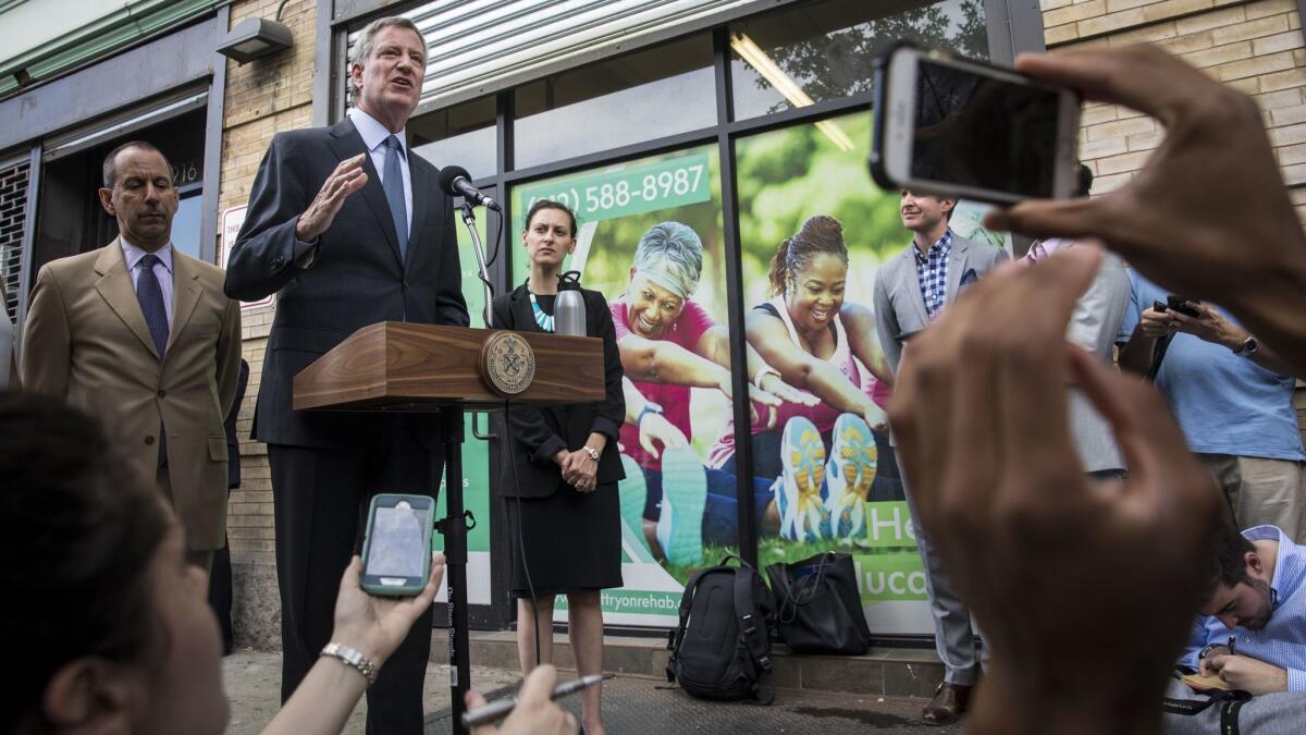 New York City Mayor Bill de Blasio speaks to reporters following a visit to a facility that holds more than 230 children who were separated from their families at the U.S.-Mexico border.