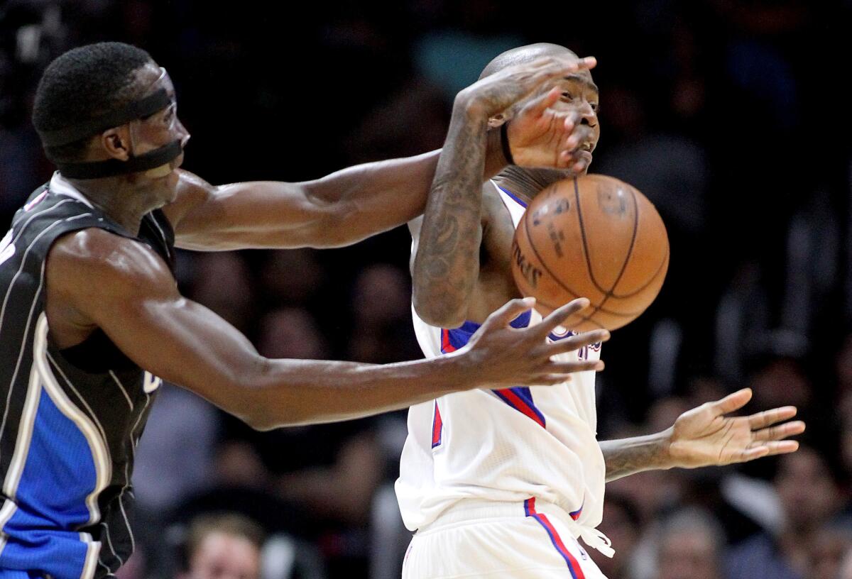 Clippers guard Jamal Crawford loses control of the ball against Magic guard Victor Oladipo in the second half.