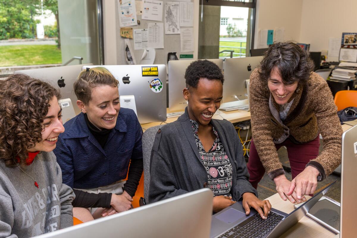 Students Elise Gilmore, Natalie Casson, Liza Clairagneau and Professor Liz Safran
