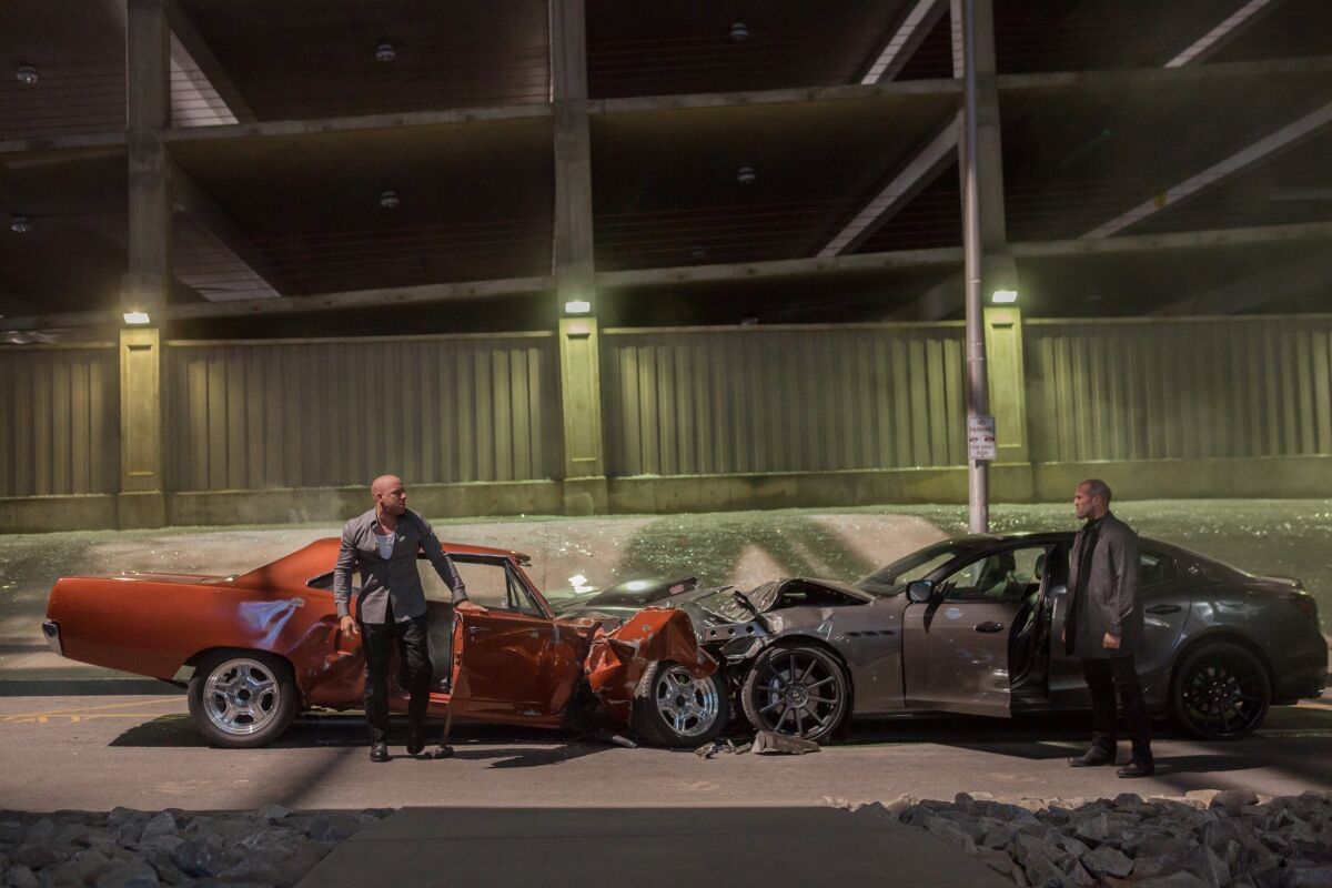 Vin Diesel, left, plays Dom Toretto and Jason Statham plays Deckard Shaw in a scene from "Furious 7." The Universal Pictures film was No. 1 for the fourth consecutive weekend at the box office, earning $18.3 million. Its total domestic haul is $320.5 million.