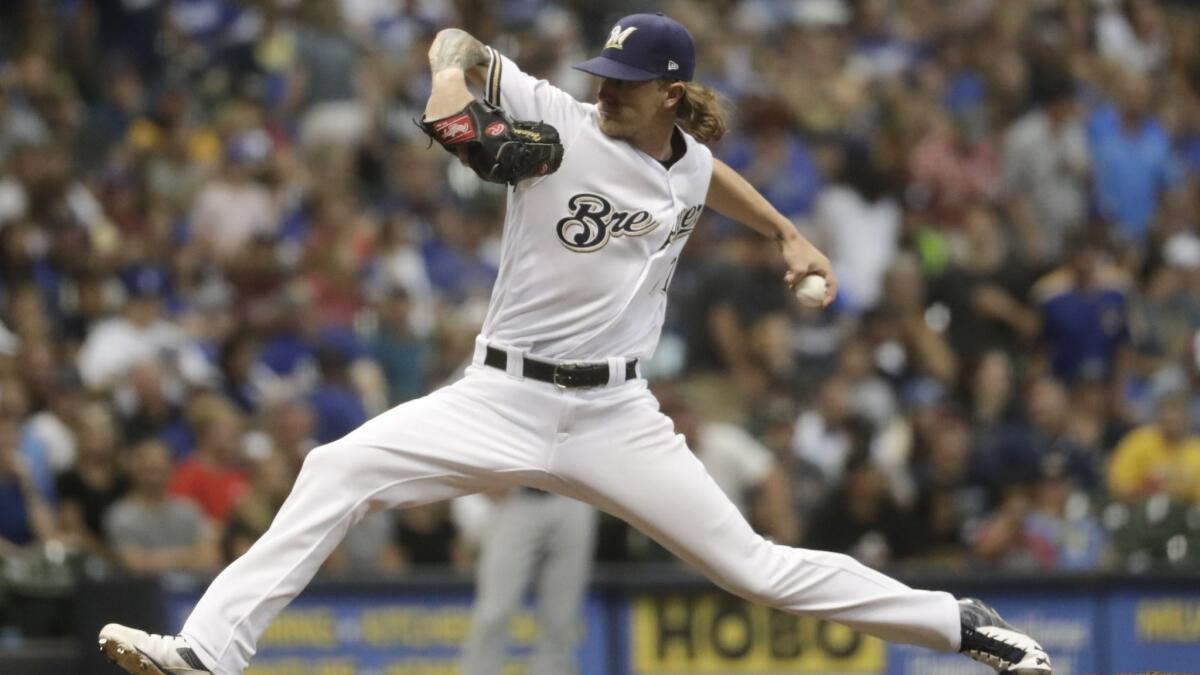 Milwaukee Brewers relief pitcher Josh Hader throws during the seventh inning of a baseball game against the Los Angeles Dodgers Saturday, July 21, 2018, in Milwaukee.
